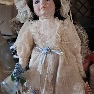 Elegant Lace Doll with Blue Accents
